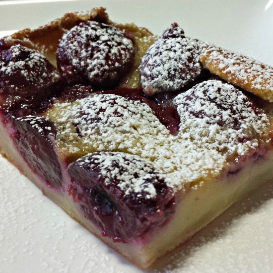 Closeup view of a slice of cherry clafoutis.