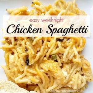 plate of easy weeknight chicken spaghetti with buttered bread