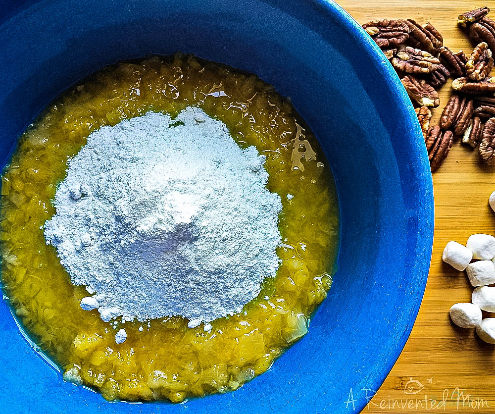 Ingredients to make the pistachio pudding recipe in a blue bowl.