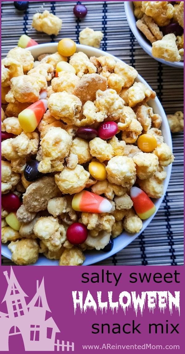 Large bowl of Salty Sweet Halloween Snack Mix on a mat | A Reinvented Mom