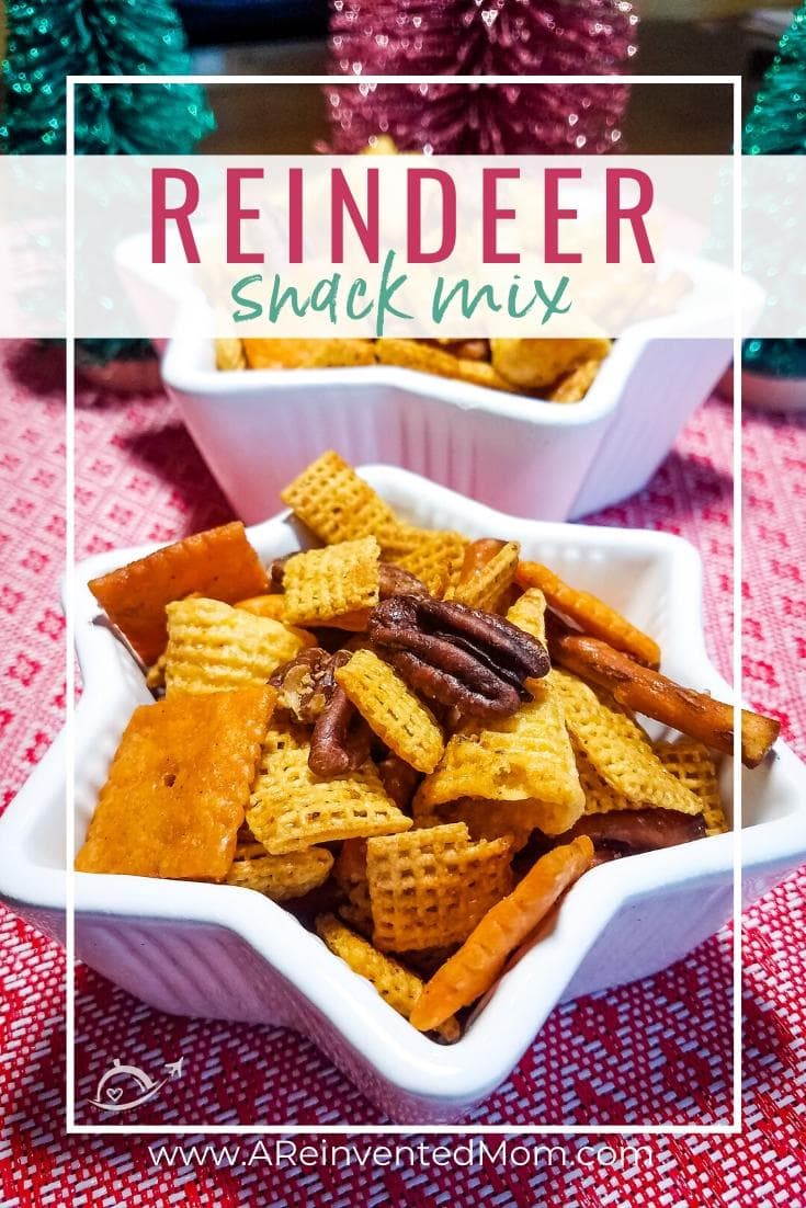 Closeup view of a white star-shaped bowl filled with corn Chex cereal, Bugles corn snacks, pretzels, cheese flavored crackers & pecans. Reindeer Snack Mix Pinterest image| A Reinvented Mom Reindeer Snack Mix | A Reinvented Mom