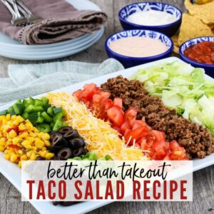 Yellow corn, green peppers, black olives, cheese, tomatoes, lettuce & ground beef with Better Thank Takeout Taco Salad Recipe graphic | A Reinvented Mom