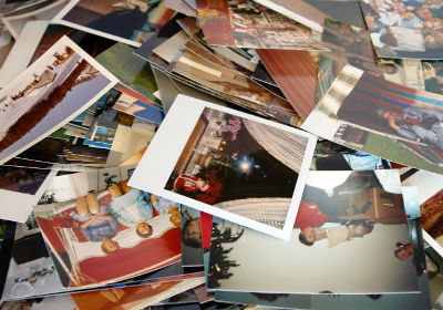 Side view of a stack of old photos.