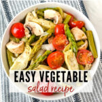 easy vegetable salad from the top view in a white bowl sitting on top of a striped towel with text overlay