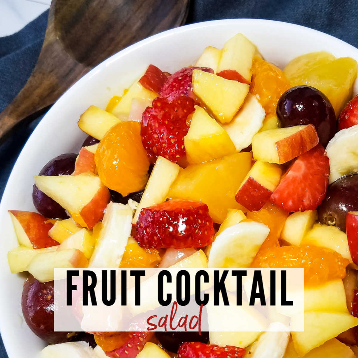 top view of fruit cocktail salad ready to serve with text overlay