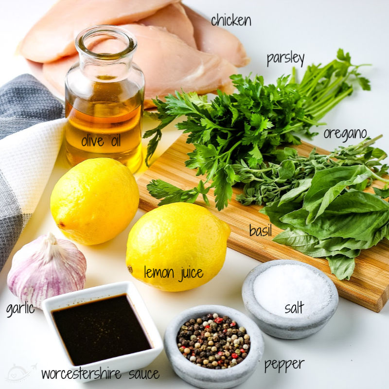 All of the ingredients needed for grilled italian chicken sitting on the kitchen countertop