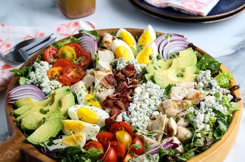 Close up of Chicken Cobb Salad in a bamboo bowl