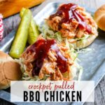 Crockpot pulled bbq chicken sandwiches on a metal serving tray with pickles on the side and text overlay.