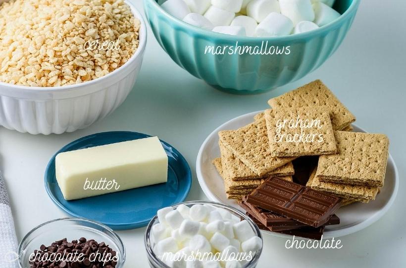 all of the ingredients for s'mores sitting on the counter labeled
