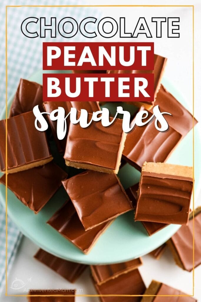 Close up of peanut butter squares on a cake stand.