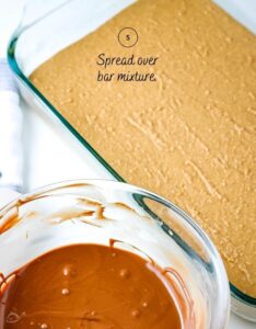 mixing bowl after peanut butter and chocolate has been mixed together next to baking dish