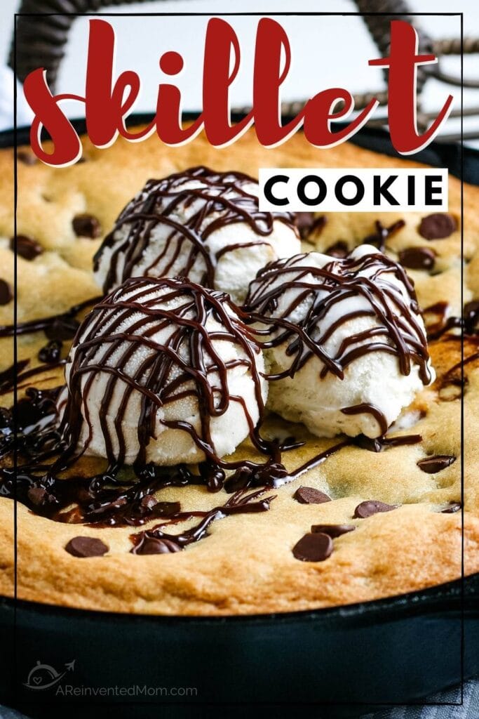 Chocolate chip cookie baked in a cast iron skilled topped with ice cream with text overlay.