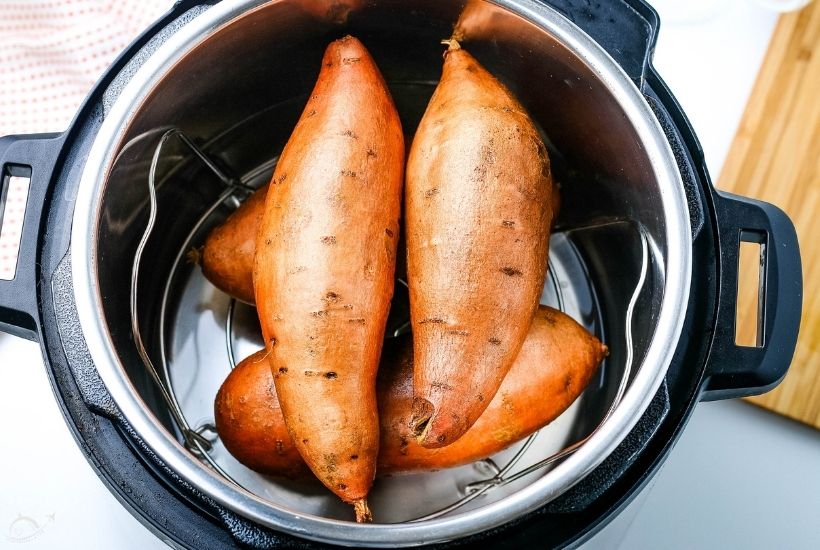 top view of sweet potatoes sitting inside of an Instant Pot