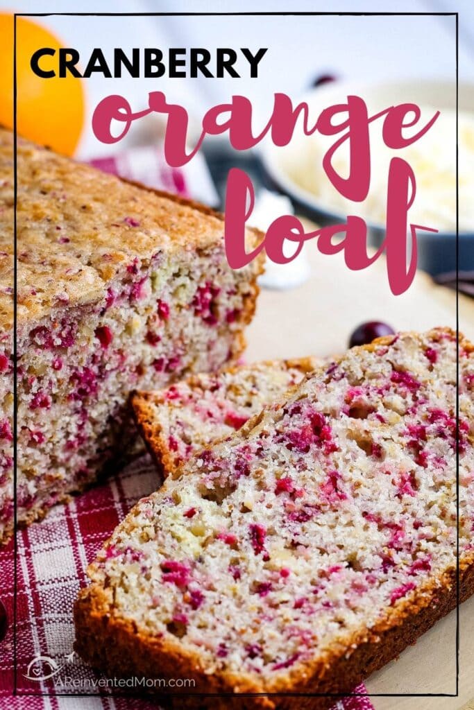 Close up of cranberry orange loaf with a slice cut out.