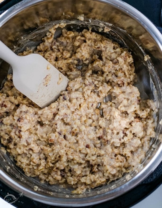 top view of cooked oatmeal with a spoon