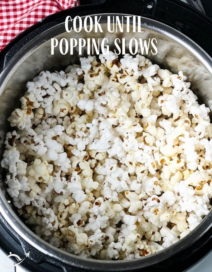 Popcorn in Instant Pot- with text overlay cook until popping slows