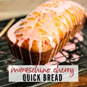 a loaf of cherry bread on a wire rack with a cherry glaze and text overlay