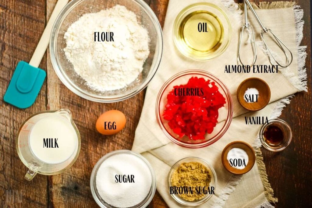 ingredients in different bowls for cherry quick bread and labeled with text