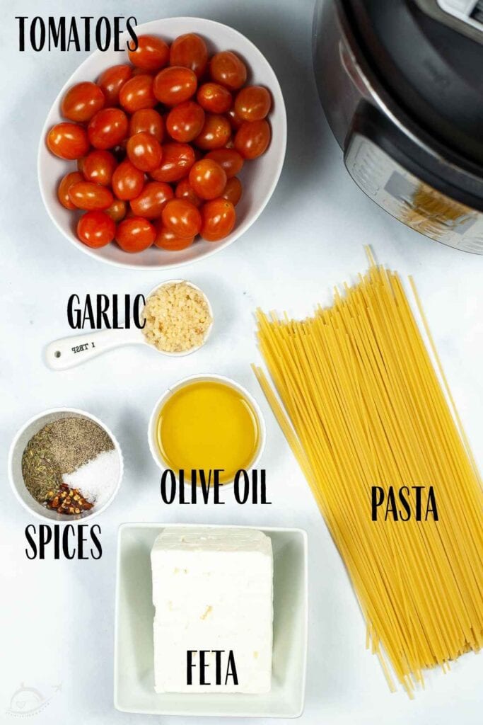 Ingredients to make Tiktok feta tomato pasta recipe, with labels.