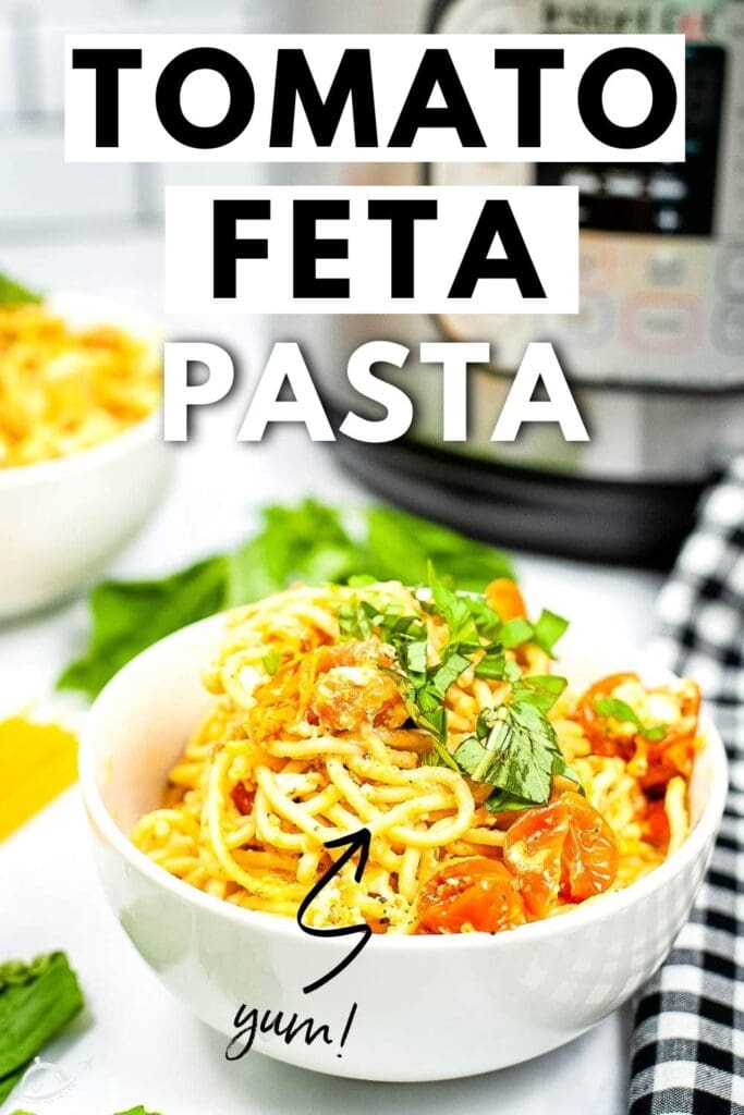 bowl of spaghetti with tomatoes and feta cheese with black and white napkin and graphic overlay