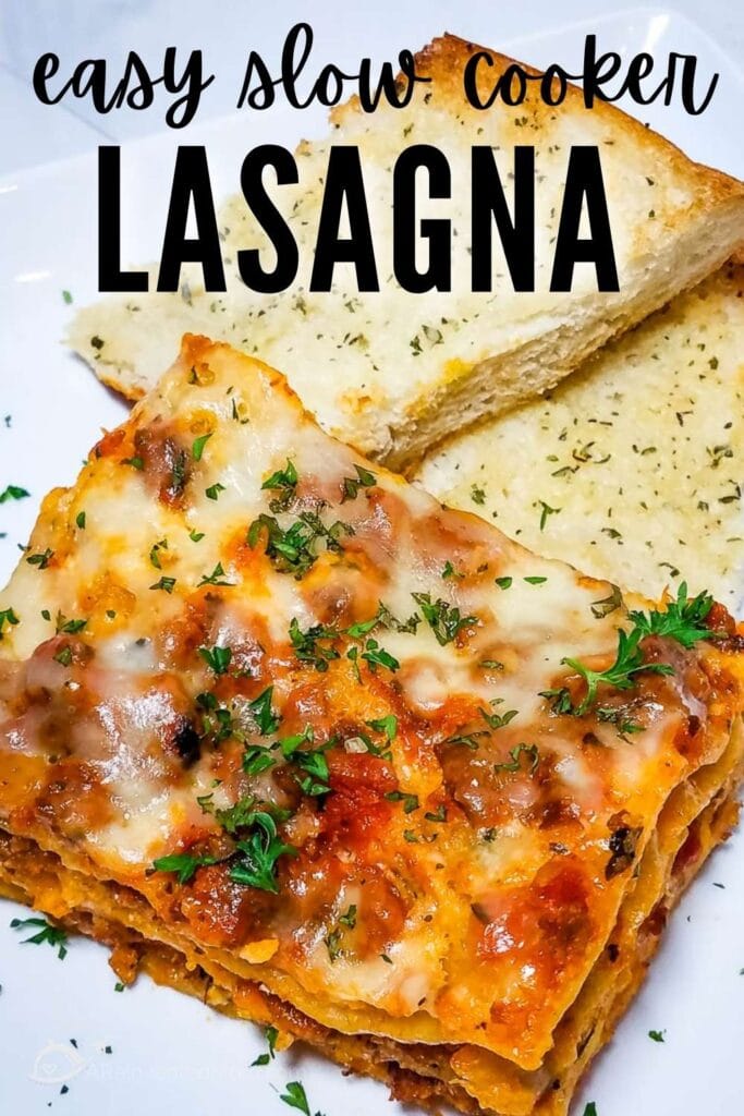 closeup view of slice of lasagna with parsley garnish and garlic bread with graphic overlay