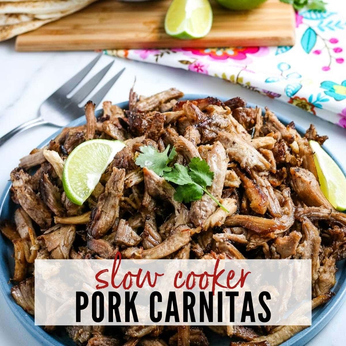 pork carnitas on a blue plate topped with a lime wedge with text overlay
