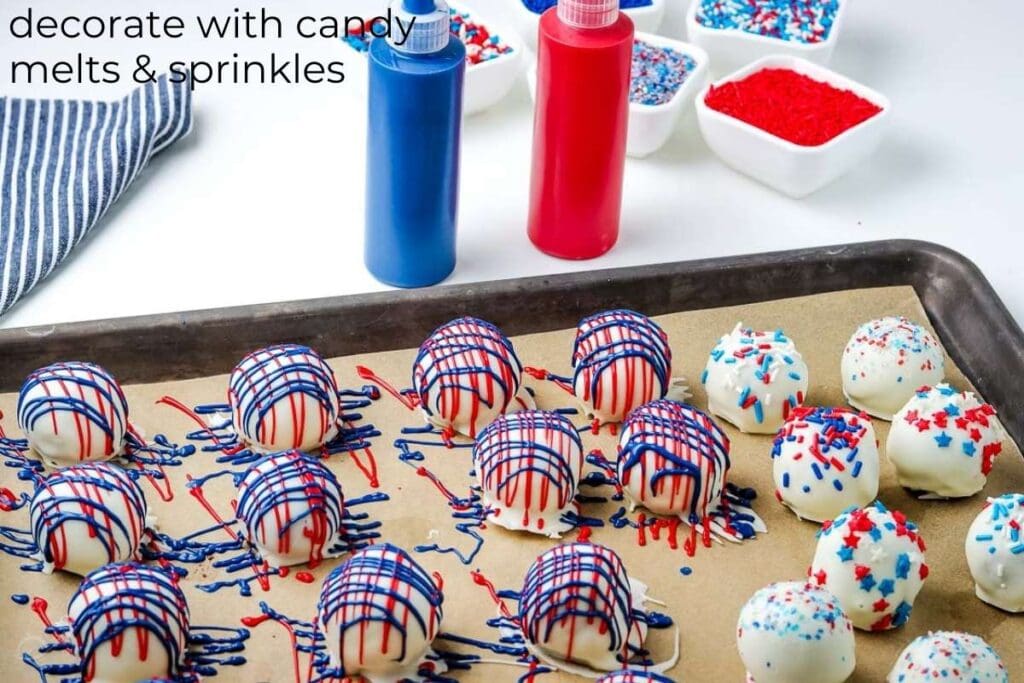 dipped oreo balls on a cookie sheet next to sprinkles and melted red and blue candy melts