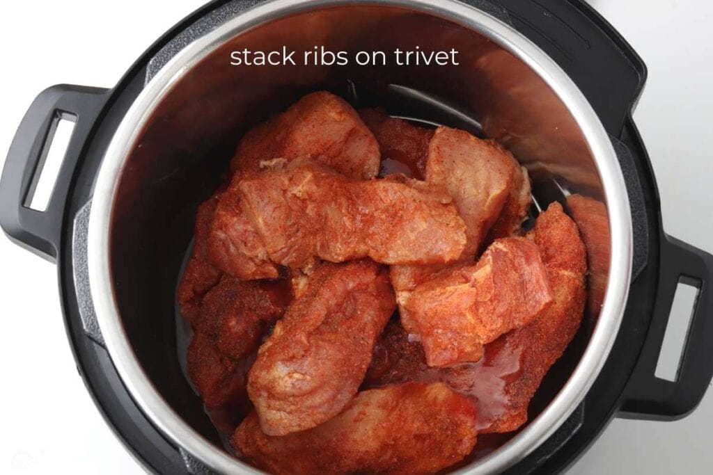 country ribs stacked in instant pot on trivet