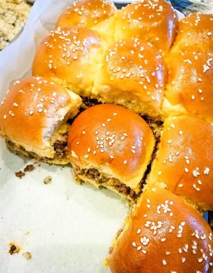 top shot of cheeseburger sliders in a baking dish