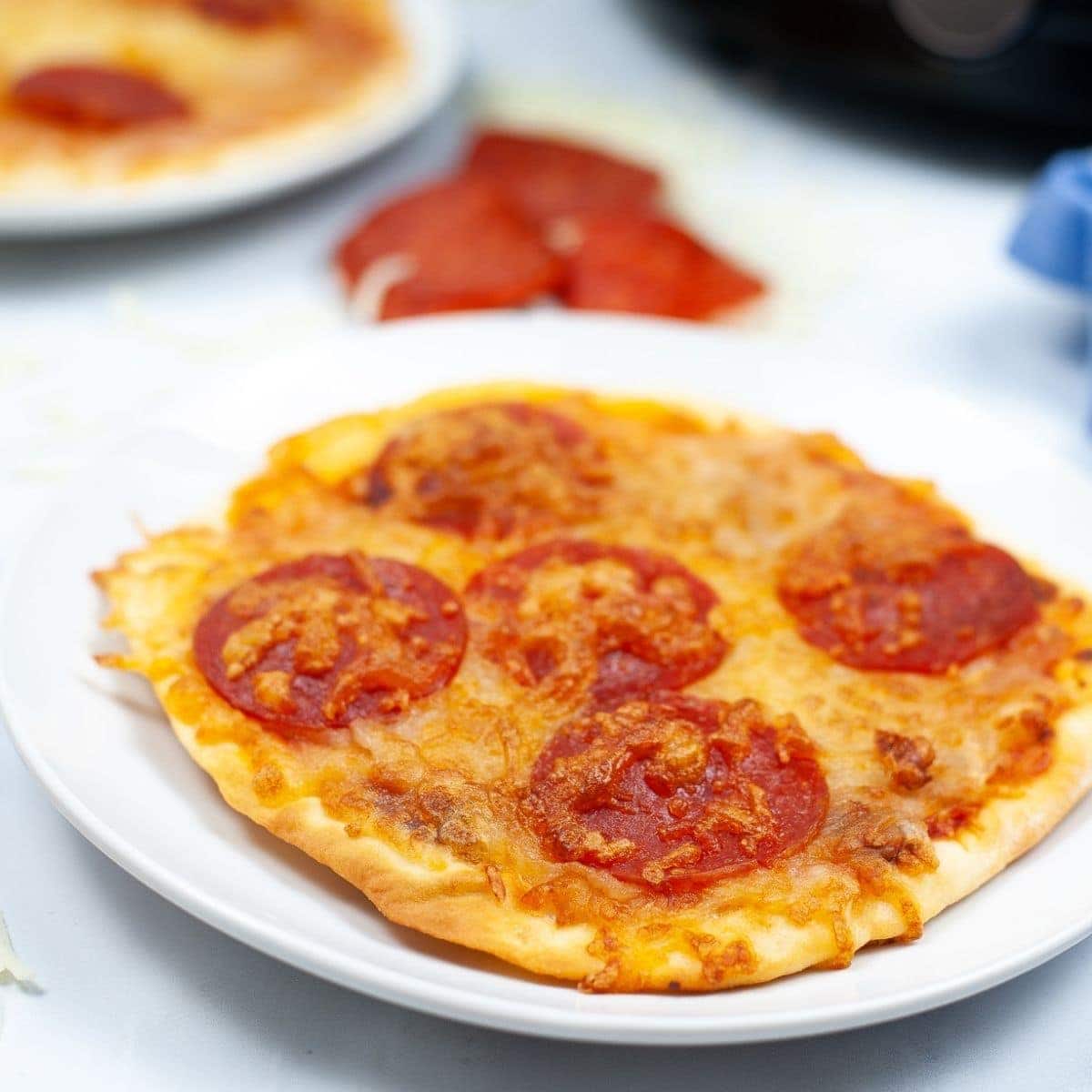 close up of individual naan bread pepperoni pizza made in the air fryer