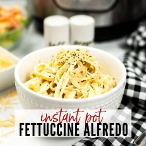 Fettuccine alfredo made in the instant pot in small white bowl with text overlay