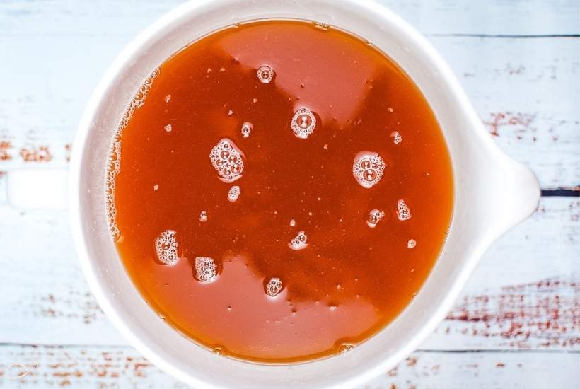 top view of instant pot apple cider in a white pitcher