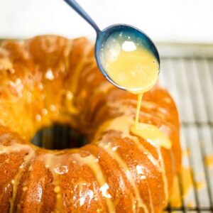 espresso glazed being drizzled over chai bundt cake