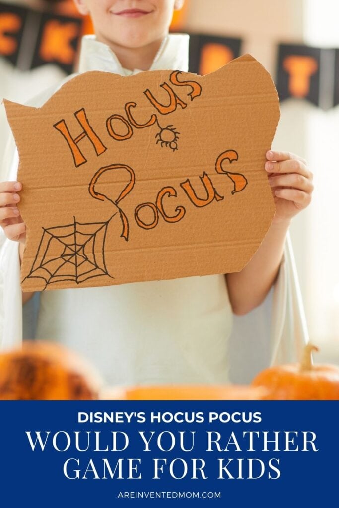 tween holding a hocus pocus sign with text overlay