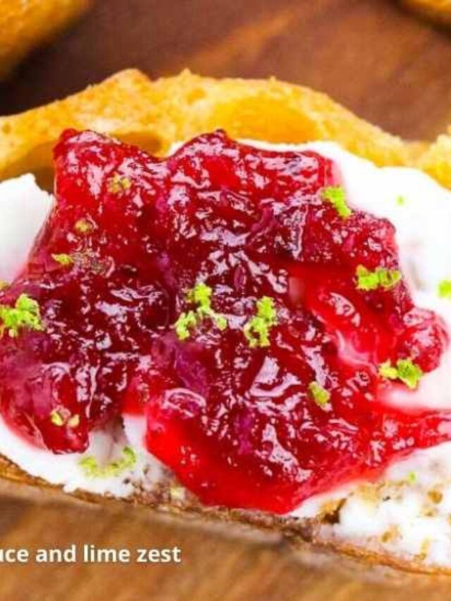 close up of cranberry crostini with lime zest and cream cheese