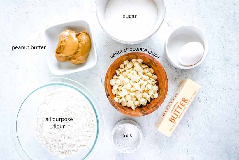 Ingredients labeled to make peanut butter white chocolate chip cookies.