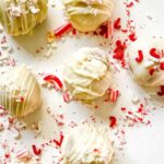 close up of peppermint cake balls with peppermint crumbs