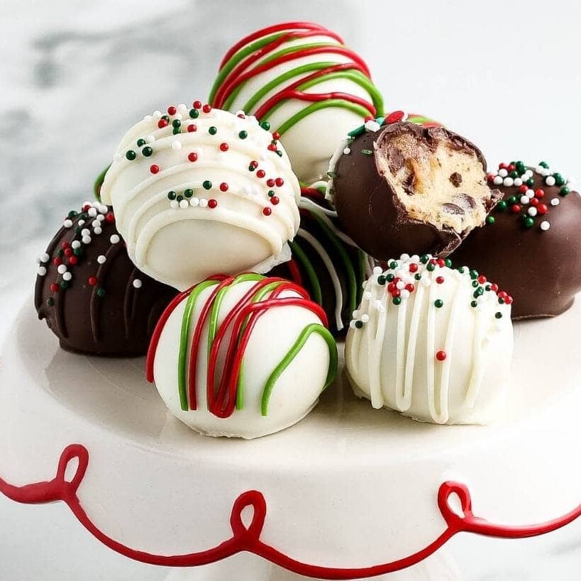 chocolate covered cookie dough bites decorated for the holidays with text overlay