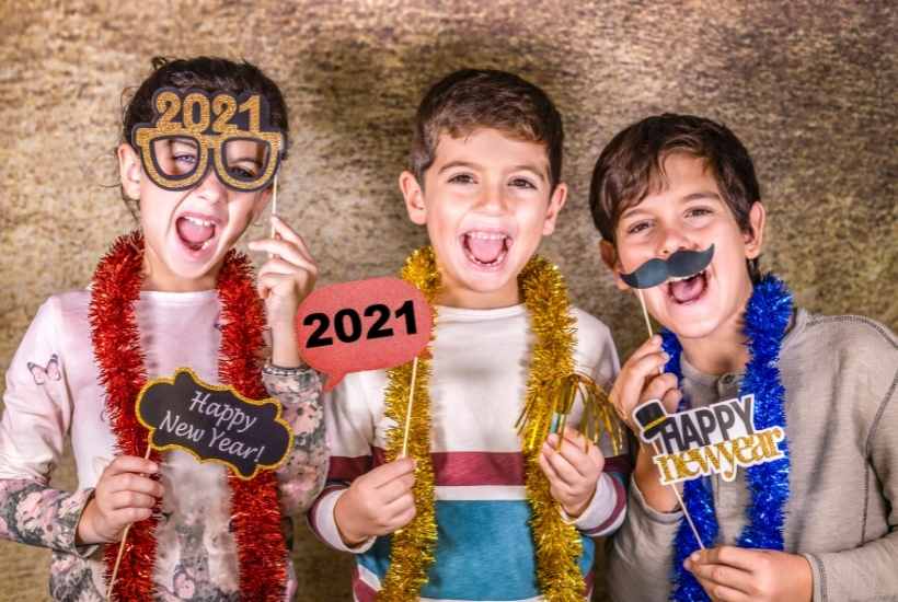 Kids dressed up at family friendly new years eve party.