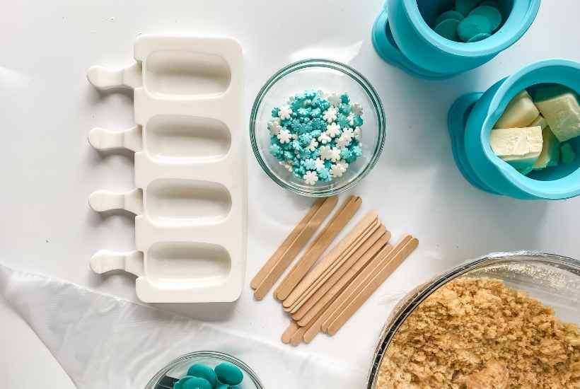 top view of ingredients to decorate winter wonderland cakesicles.