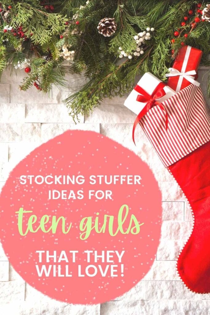 stocking with presents in it hanging on a mantle with text overlay