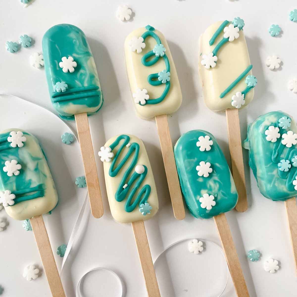 top view of cakesicles decorated in a  winter wonderland theme.