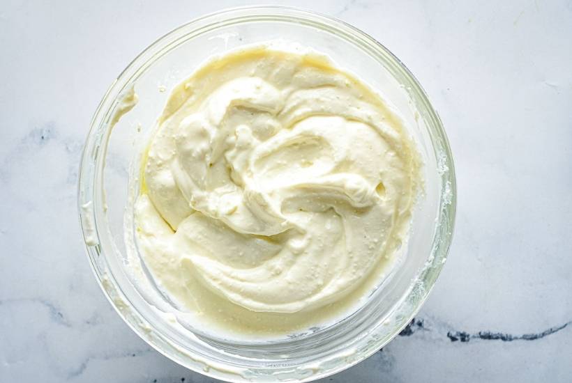 creamy feta dip in a glass mixing bowl