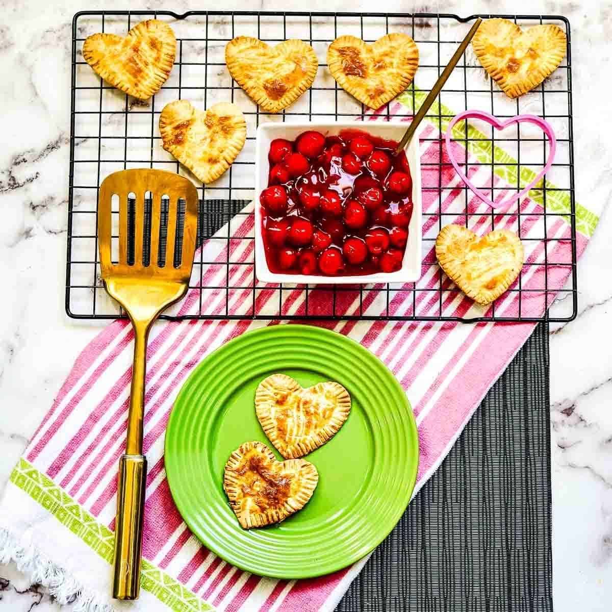 top view of heart shaped hand pies on a cooling rack pan