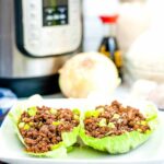 korean ground beef lettuce wraps next to an onion and instant pot
