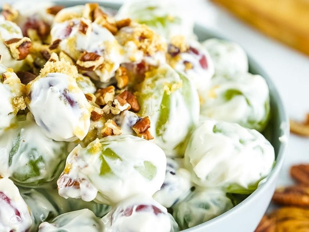 creamy grape salad with pecans in a small bowl