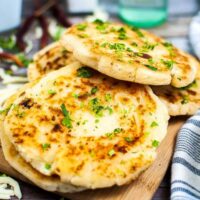 slices of Arepas Con Queso on a cutting board