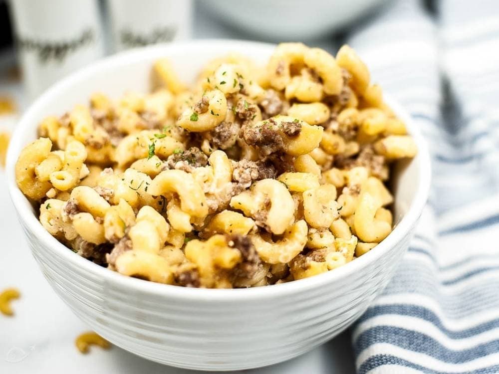 homemade cheeseburger macaroni in a white bowl.