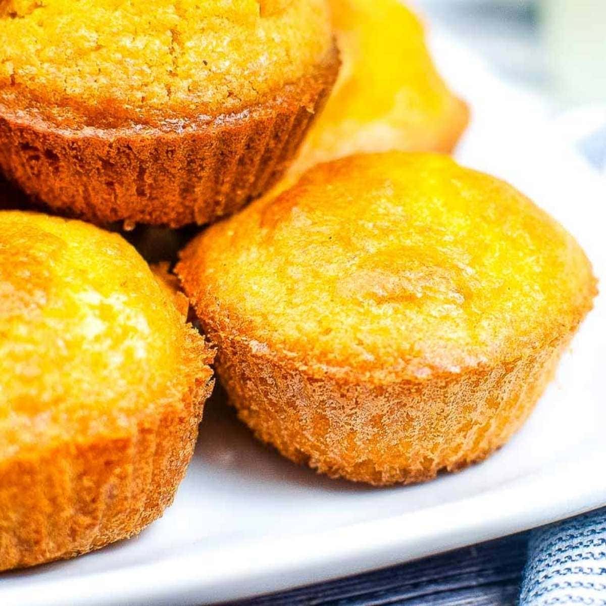 close up of air fryer cornbread muffins on a white plate