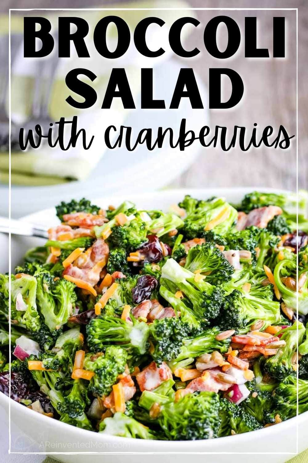 closeup of bowl of broccoli salad with bacon and cranberries with text overlay